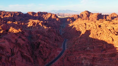 An aerial view of the Valley of Fire legally flown in 4K at sunset. This breathtaking view of Mouse Tank Road is any photographer's dream, an out of this world view.