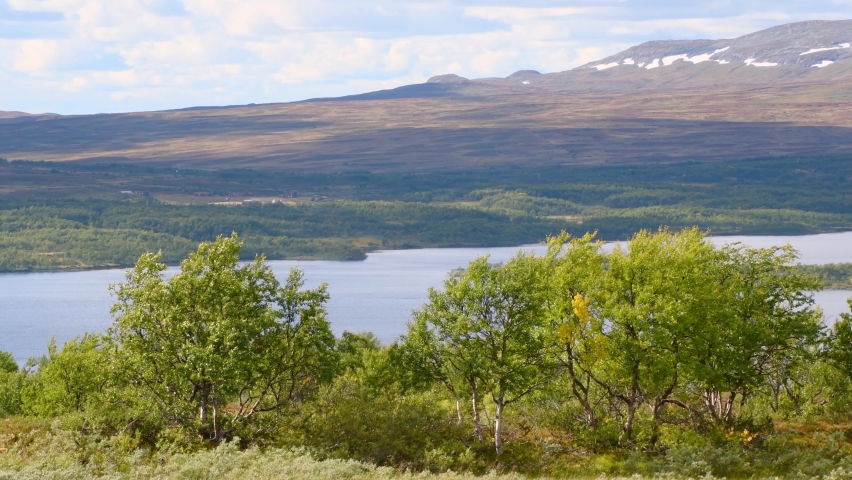 Beautiful norwegian landscape with natural lake and mountains in background during sunlight. Fjell,Norway.