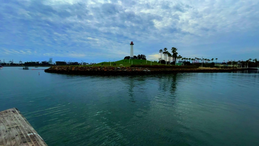Wide angle shot of the bay and light house in Long Beach, CA on the harbor.