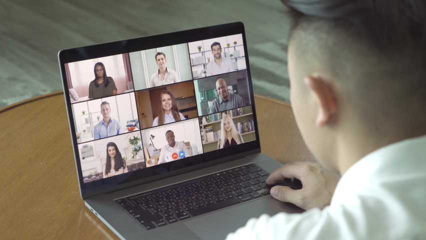 Asian man talking to multi ethnic group of business people working from home and office, talking to colleagues in webcam group video call conference technology on screen online in quarantine. Team | Shutterstock HD Video #1069040197
