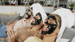 Video of women in a face mask relaxing at home. Shot with RED helium camera in 8K 