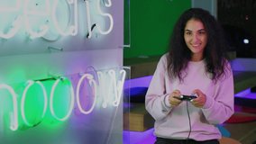 video games in anti-cafe, entertainment and fun for youth, woman is playing