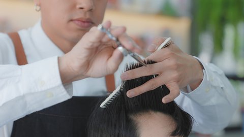 Professional hairdressers to design hair for customer. Beauty salon or barber shop business concept. slow motion