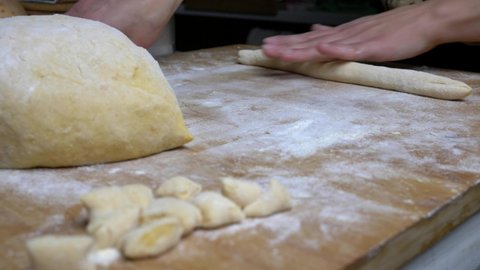 Close up process of preparing homemade potato dumplings. Homemade pasta preparation. Slow motion 4K