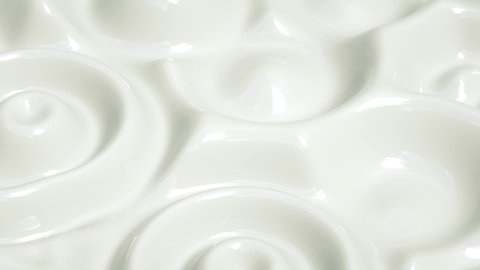 Super slow motion of milk cream. White smooth glossy abstract elegant liquid animation background. Liquid abstract white background. 3D rendering loop 4k. 