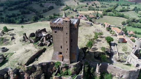 Aerial view of the Fortress of Polignac located on a volcanic hillock a historic site and a popular tourist attraction in the past the Chateau has inspired and seduced famous visitors 4k quality