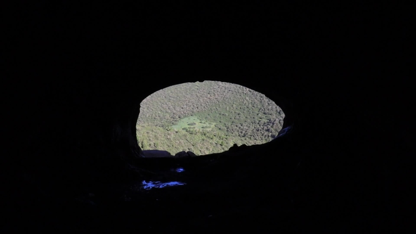 Man Exploring Cave Entrance, Cave Adventure, Cave exploration 