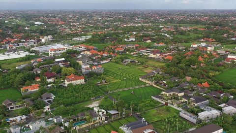 Aerial drone footage of the famous Canggu village, a trendy place north of Seminyak in Bali, Indonesia.