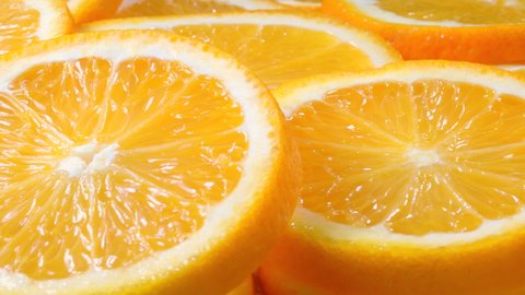Macro shot of fresh juicy orange fruit slices. Close-up fruit texture.