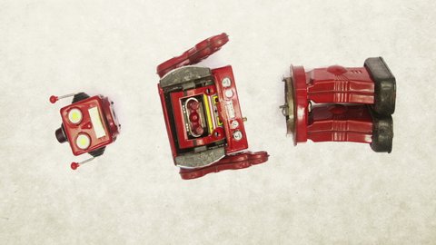 the retro big red robot gets fixed buy little bots.
