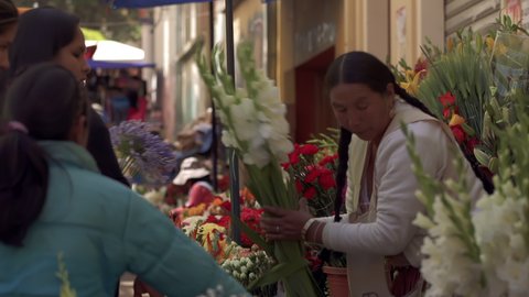 COCHABAMBA, BOLIVIA - August 2020: Flowers Sellers in a Street of Cochabamba, during the Virgin of Urkupiña Festival, Bolivia.
