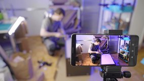 Influencer shooting video of kitchen furniture assembling 4K