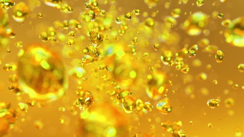 Yellow bubbles flying in super slow motion 4K