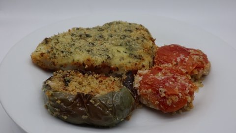 Baked Halibut Fillet with baked stuffed pepper and stuffed tomatoes. 