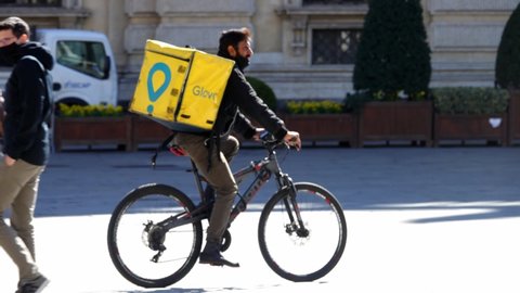 Rider of home delivery food at work. Milan, Italy - March 2021