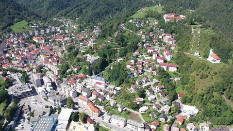 Panoramic view of small Slovenian town Idrija on sunny day