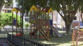a children's play park closed excessively with tapes that say 