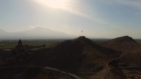Aerial view Khor Virap monastery. The Armenian flag against the background of Ararat. The Khor Virap is an Armenian monastery located in the Ararat plain in Armenia, near the border with Turkey.