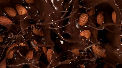Super Slow Motion Shot of Almonds Falling into Melted Chocolate at 1000 fps.