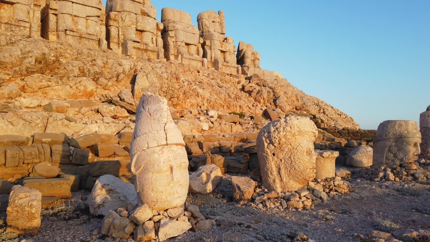 Nemrut is a 2,134-metre-high mountain in southeastern Turkey, notable for the summit where a number of large statues are erected around what is assumed to be a royal tomb from the 1st century BC. It i Royalty-Free Stock Footage #1069154722