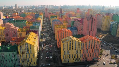 Colorful buildings of a residential district, aerial shooting from a drone. Top view of colorful buildings, aerial footage. Arkivvideo