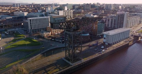 Glasgow, Scotland March 2021:  drone aerial sunrise panning view of the finnieston Crane