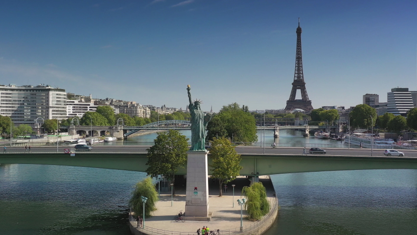 day time paris city famous river statue of liberty monument traffic bridge tower district aerial panorama 4k france