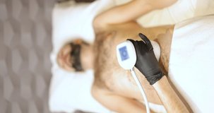 Man during ultrasound non-invasive liposuction procedure
