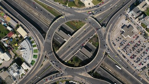 Aerial drone hyperlapse video of urban elevated toll road junction and interchange overpass ring road and Attiki odos of Attica, Athens, Greece