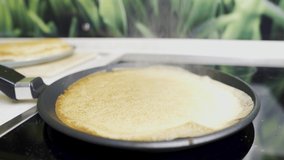 Fry pancakes, pancake dough in a pan. Steam. Video slide, close-up