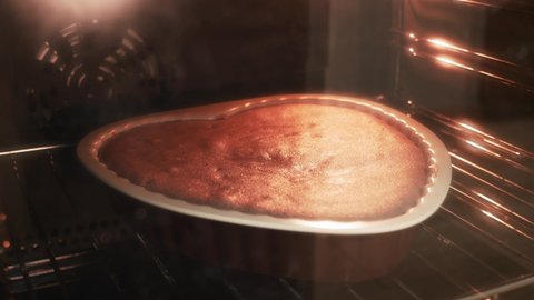 Timelapse of baking cake in oven. Tasty pie in oven. Homemade pie baked. Delicious cake biscuit is rising up in oven. Process of making sweet pastry