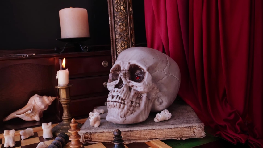 allegorical still life in the baroque genre Vanitas, a skull on a book, chess, candles are burning, concept of the transience of life, the futility of pleasures and inevitability of death.