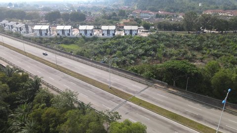 Desa Pinggiran Putra, Malaysia - March 13, 2021: Drone view on highway which shows car moving on the highway in Desa Pinggiran Putra. Desa Pinggiran Putra is border of Selangor and Putrajaya. 