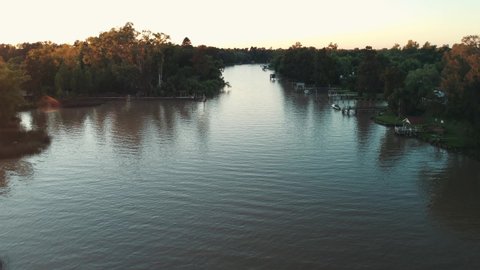 Beautiful Traveling Forward Morning Drone Shot Over a River in Buenos Aires, Argentina.