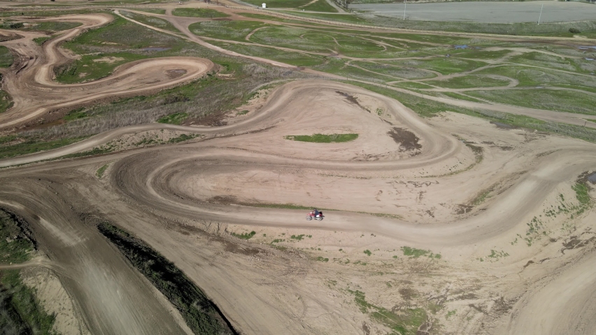 Two dirt bikes cornering on Prairie City Off-Highway motor vehicle recreation at the foothills of the Sierra Nevada foothills