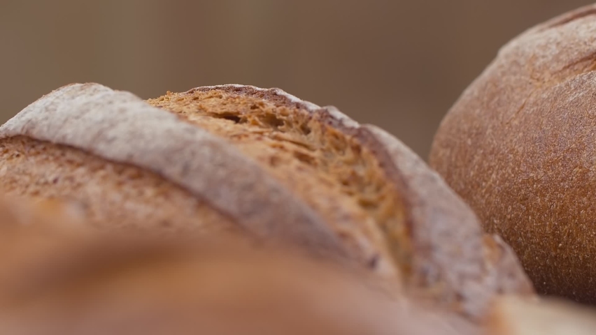 Close-up of fresh baked whole grain bread move in slow motion. | Shutterstock HD Video #1069192549