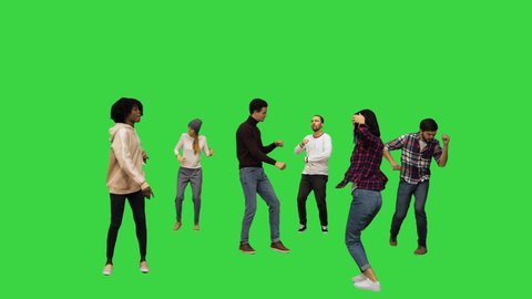 Wide shot. Front view. Flashmob: young people walk in and start dancing on a Green Screen, Chroma Key. Professional shot in 4K resolution. 042. You can use it e.g. in your medical, commercial video,