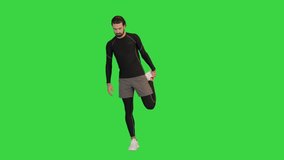 Wide shot. Front view. Fitness man doing warm up exercises on a Green Screen, Chroma Key. Professional shot in 4K resolution. 068. You can use it e.g. in your medical, commercial video, business,