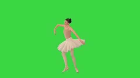 Wide shot. Professional ballerina in a white tutu dances on a Green Screen, Chroma Key. Professional shot in 4K resolution. 069. You can use it e.g. in your medical, commercial video, business, prese