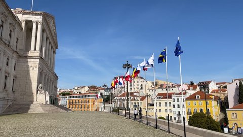 European Country Flags Waving On flagpoles, Portugal. Many European country flags waving on flagpoles on a windy day in Lisbon, Portugal