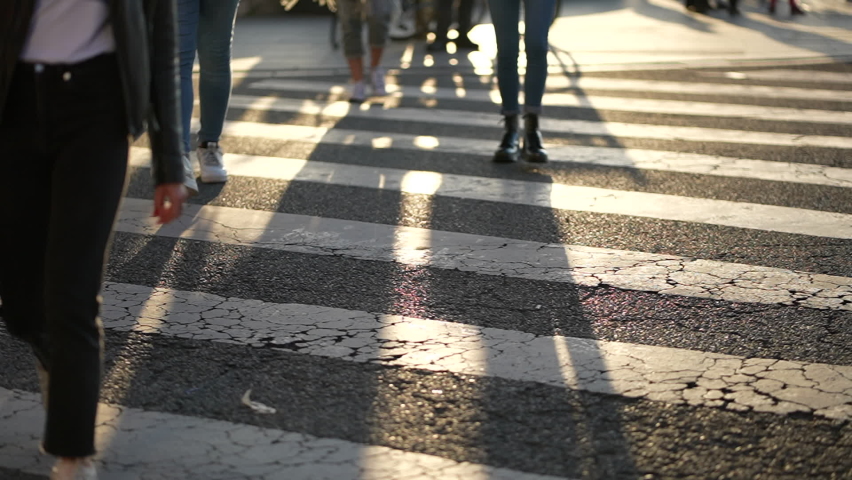 Pedestrians feet walking on zebra lines in city crossing street Royalty-Free Stock Footage #1069200526
