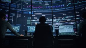 Professional IT Technical Support Specialists and Software Programmer Working on Computers in Monitoring Control Room with Digital Screens with Server Data, Blockchain Network and Surveillance Maps. - Powered by Shutterstock - Get 15% off with code: PIKWIZARD15
