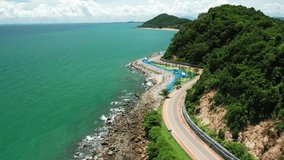 Aerial view Beautiful sea road, Noen Nang Phaya view point, winding road, location near the sea, Chanthaburi, Thailand. The road is suitable for driving on vacation.

