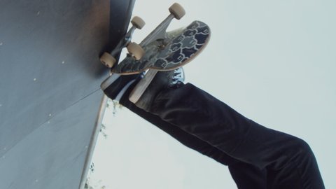 Young adult skateboarding halfpipe 4k super slow motion shot on R3D