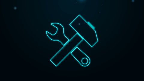 Glowing neon line Crossed hammer and wrench icon isolated on black background. Hardware tools. 4K Video motion graphic animation.