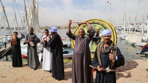 Luxor, Egypt - November 18 2014: An Egyptian traditional music group welcoming visitors to Felucca boats on river Nile