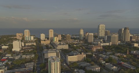 St Petersburg Florida Aerial v7 dolly in shot of downtown, Tampa Bay and airport during golden hour - Shot with Inspire 2, X7 camera. March 2020