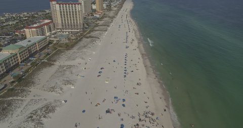 Pensacola Beach Florida Aerial v3 crowds of tourists head to the beach - Shot with Inspire 2, X7 camera. March 2020