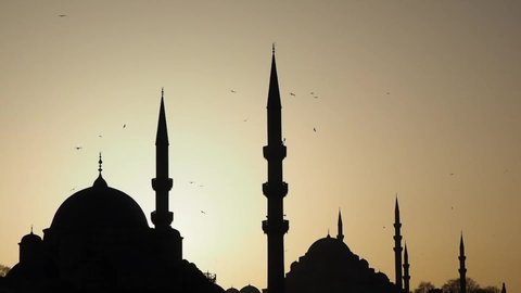 silhouette of mosque at sunset yellow sky domes and minarets