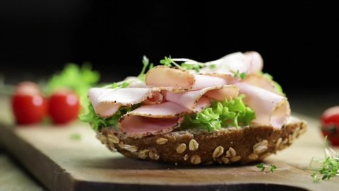 Sliced ham on seeded bread with salad